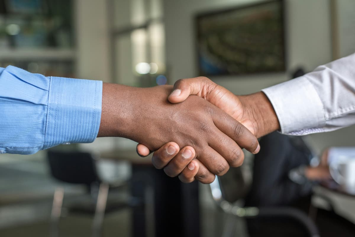 Maritime professionals shaking hands